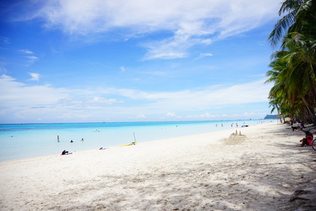 Boracay beach with white sand and blue sky with cloudの写真素材
