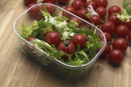 Spring composition salad and tomatoes.の写真素材