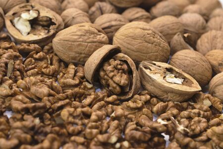 Background from whole and peeled walnuts.