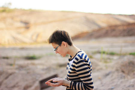 closeup of womans hands holding a stonesの写真素材