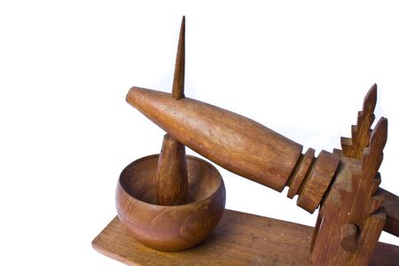 Wooden mortar and pestle for grinding riceの写真素材