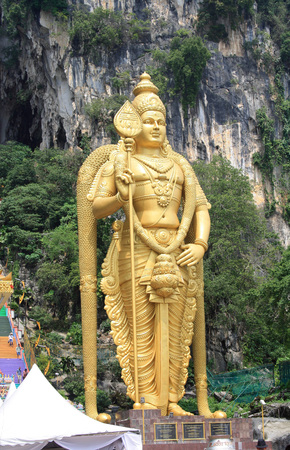 The Batu Caves Lord Murugan Statue and entrance near Kuala Lumpur Malaysia. A limestone outcrop...