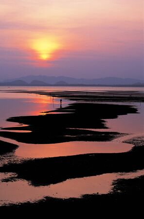 Sunset at beach in southern Thailandの写真素材