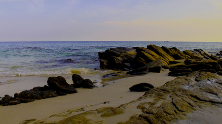 The beaches are rocky, beautiful blue sky.の写真素材