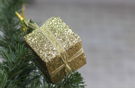 gift box on the christmas tree backgroundの写真素材