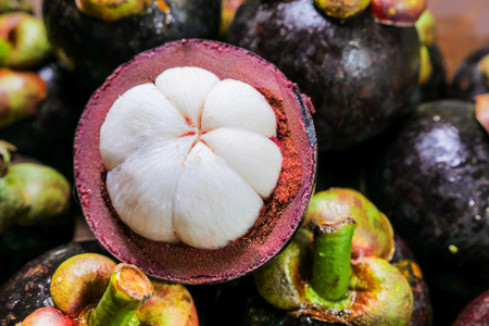 set of Purple mangosteen a queen of tropical Fruit  on tableの写真素材