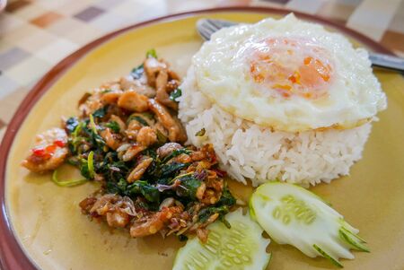 Pad Ka-Prao (holy basil-stir-fry) most popular street food dishes. with rice and fried eggの写真素材