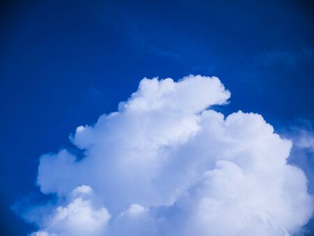 clear blue sky background with cloudsの写真素材