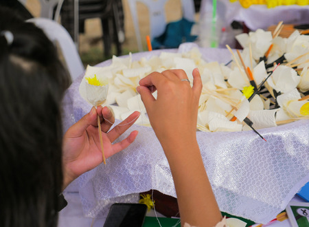 People making Thai Funeral Flower (artificial flower used for cremation) for late King Bhumibol Adulyadej cremation.の写真素材