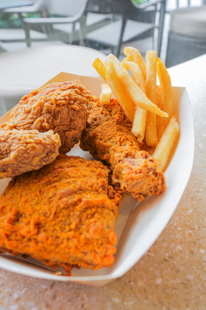 lunch set of crispy deep fried chicken and french fries, unhealthy eatingの写真素材