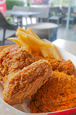 lunch set of crispy deep fried chicken and french fries, unhealthy eatingの写真素材