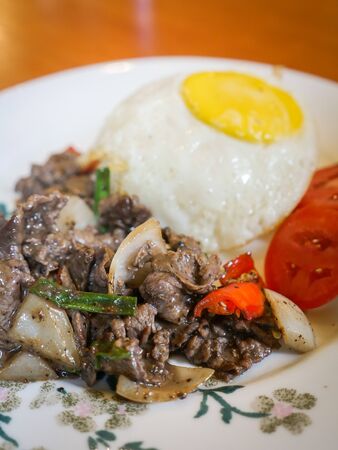 Stir Fried Pork with Black Pepper with Fried Egg and riceの写真素材