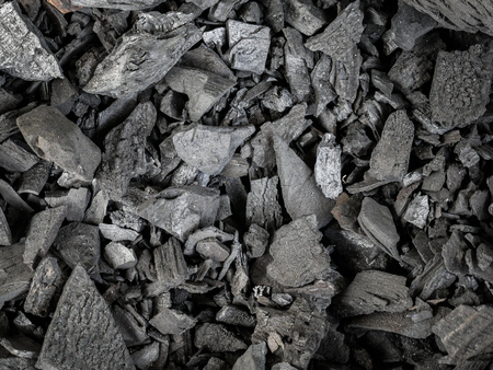 pieces of Black wood charcoal texture background.の写真素材