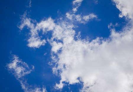 clear blue sky background with cloudsの写真素材