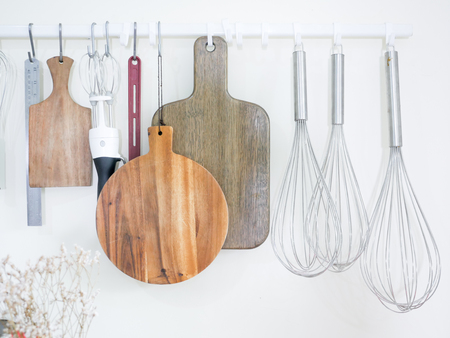 bakery equipment kitchenware utensils Preparation Tools for cooking hanging on the white wall