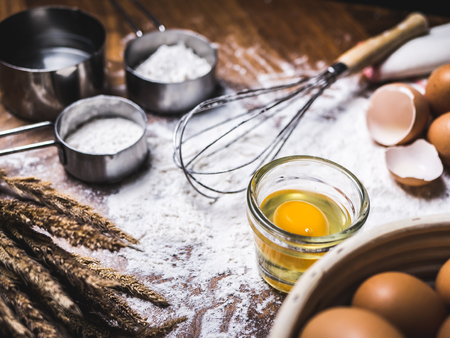 Pastry Baking Accessories Bakery Background with flour and whisk.