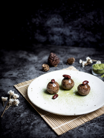 Healthy date energy balls with green tea, red bean, dried fruits and nuts.の写真素材