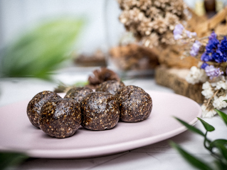 Healthy organic date energy balls with dark chocolate, dried fruits and nuts.の写真素材