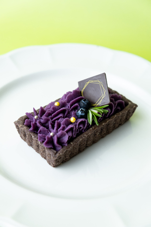 delicious Purple Sweet Potato Tart. Set on green background.の写真素材