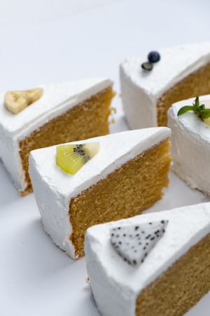 Delicious creamy minimal white cake with fruit.の写真素材