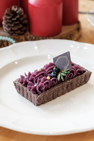 delicious Purple Sweet Potato Tart. set on wooden table
