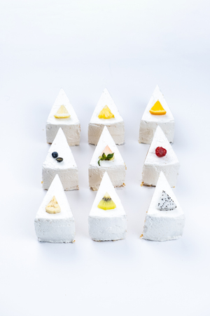 Delicious creamy minimal white cake with fruit.の写真素材