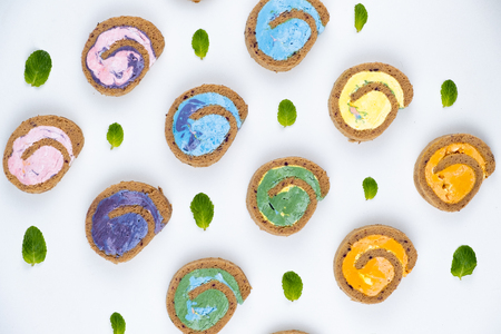 Delicious creamy colourful minimal cake roll.の写真素材
