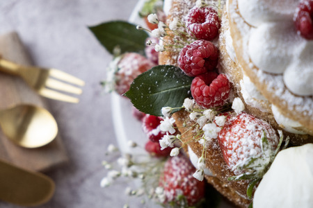 White cake Decorated with flower and berries. For celebrate party.の写真素材
