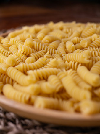 Raw Fusilli Spiral spaghetti pasta pattern background.の写真素材