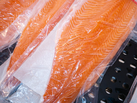 Salmon fillet in a vacuum package plastic bag.の写真素材
