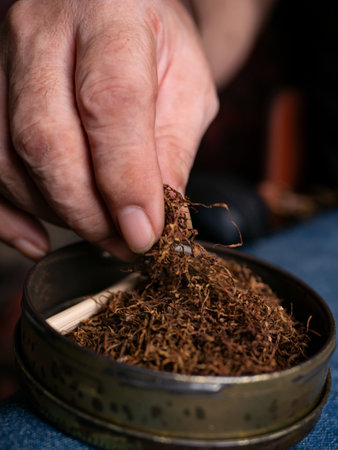 Preparing rolled cigarettes with dried tobacco.の写真素材