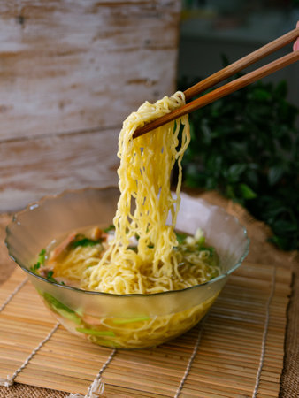 egg noodles soup with wonton roasted pork and crispy pork.の写真素材