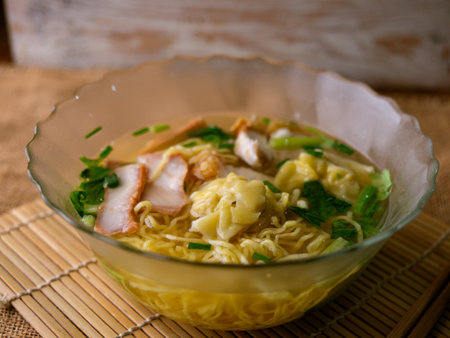 egg noodles soup with wonton roasted pork and crispy pork.