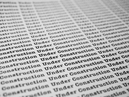 Words Under Construction Seamless print on paper for business background.の写真素材