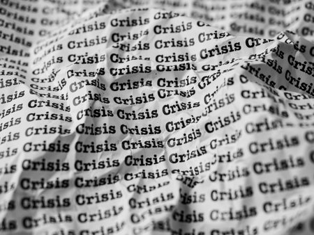Words Crisis Seamless print on crumpled paper for business background.の写真素材