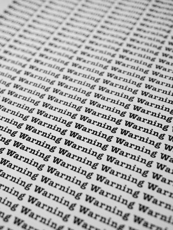 Words Warning Seamless print on paper for business background.の写真素材