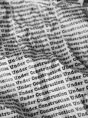 Words Under Construction Seamless print on crumpled paper for business background.の写真素材