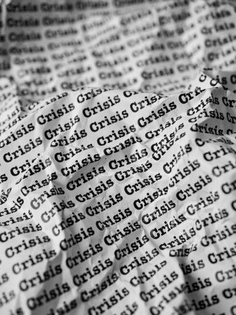 Words Crisis Seamless print on crumpled paper for business background.