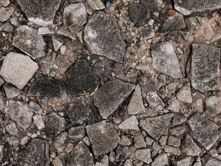 Cracked Concrete Floor with Chunky Fractures Texture Background.