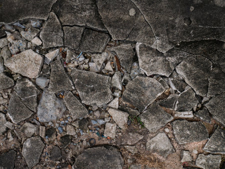 Cracked Concrete Floor with Chunky Fractures Texture Background.の写真素材