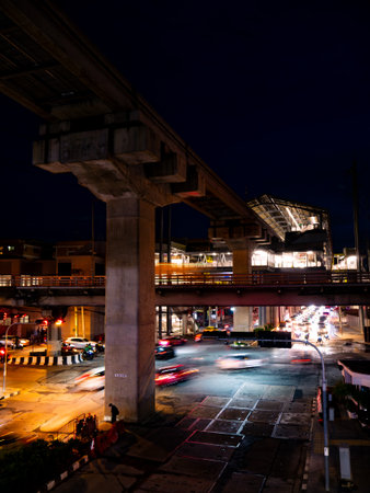 Complex Urban Infrastructure at Night - Multi-Level Highway Interchange with Light Trails and...