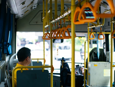 Passengers sitting on public transportation bus or train seats - commuters traveling in urban...