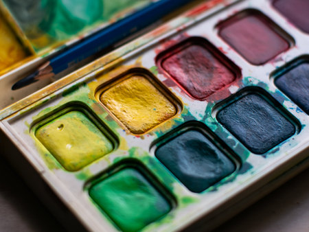 Colorful Watercolor Paint Palette Close-up - Artist Gouache Colors and Creative Art Supplies in Action.の写真素材
