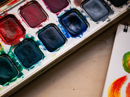 Colorful Watercolor Paint Palette Close-up - Artist Gouache Colors and Creative Art Supplies in Action.の写真素材