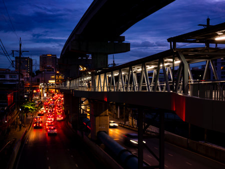 Traffic Light Trails at Twilight from Pedestrian Bridge - Urban Rush Hour with Motion Blur and City Skylineの写真素材