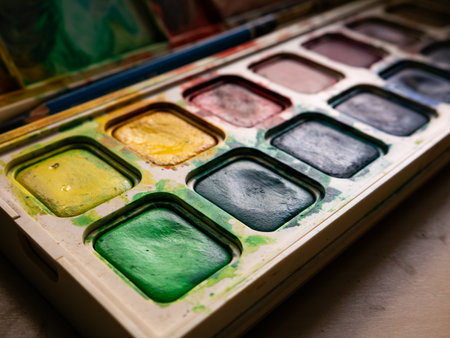 Colorful Watercolor Paint Palette Close-up - Artist Gouache Colors and Creative Art Supplies in Action.の写真素材