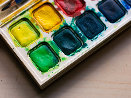 Colorful Watercolor Paint Palette Close-up - Artist Gouache Colors and Creative Art Supplies in Action.の写真素材