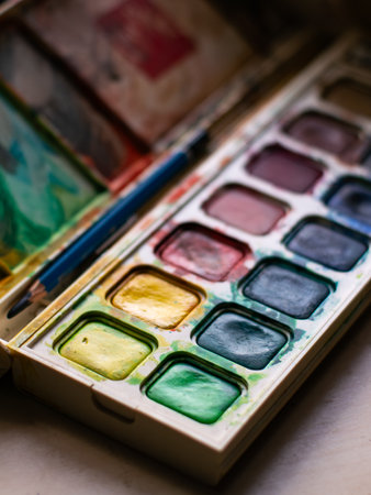 Colorful Watercolor Paint Palette Close-up - Artist Gouache Colors and Creative Art Supplies in Action.の写真素材