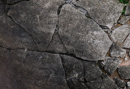 Cracked Concrete Floor with Chunky Fractures Texture Background.の写真素材