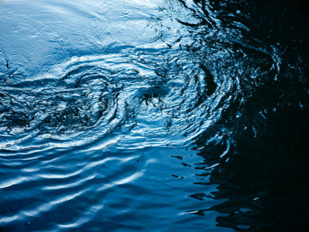 Abstract Blue Water Ripples and Waves Close-Up - Tranquil Ocean Surface Texture Backgroundの写真素材